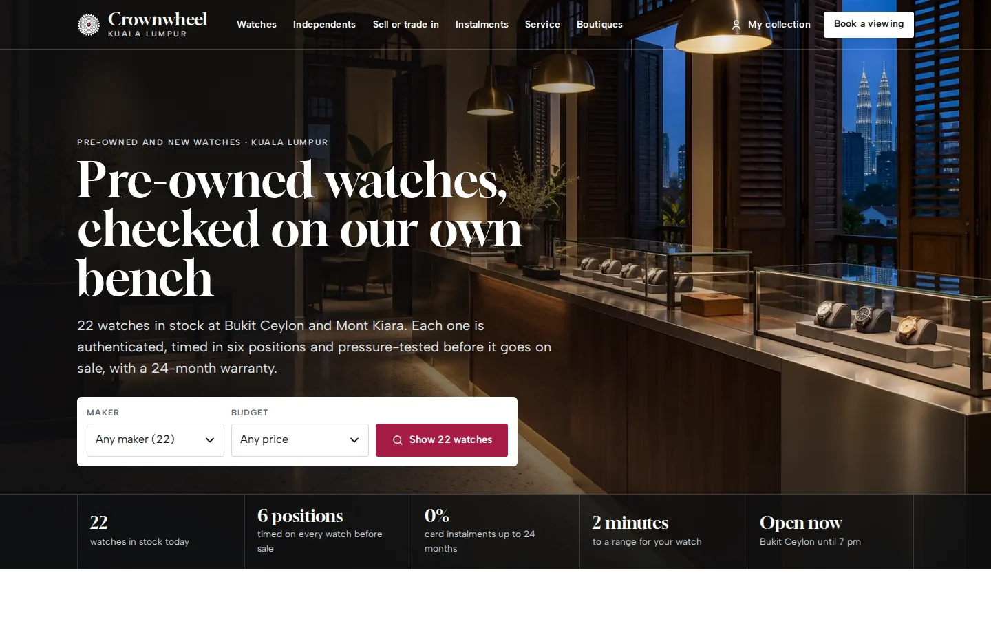 Watch boutique home page at dusk with display cases, the headline Pre-owned watches, checked on our own bench, a stock search and a facts strip, Crownwheel concept prototype