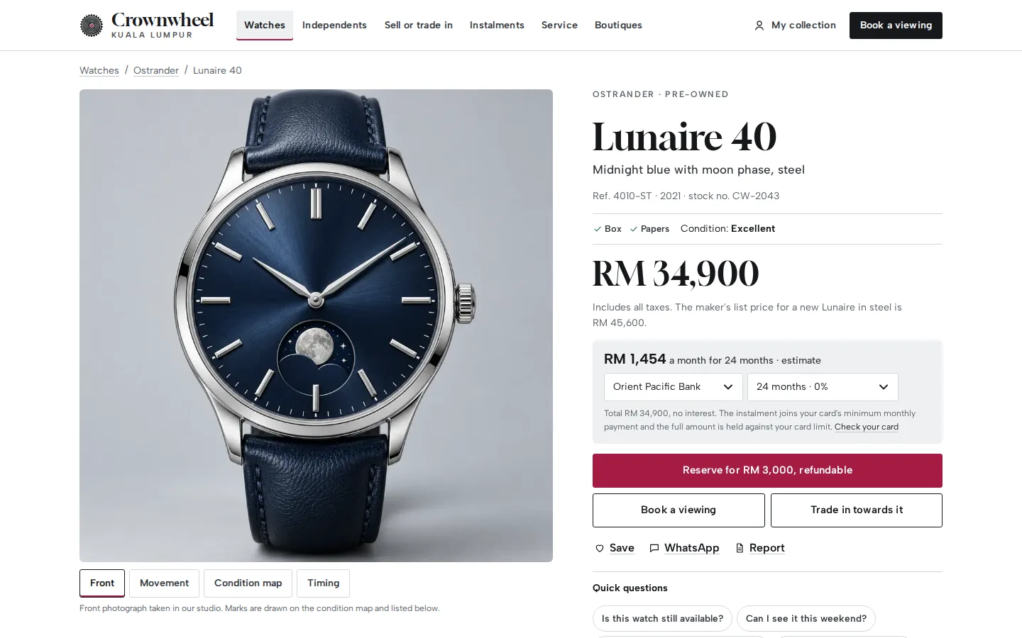 Watch page for a blue moon-phase watch with a studio photo, grade, box and papers, the price, a card-instalment estimate and a refundable reservation button, Crownwheel concept prototype